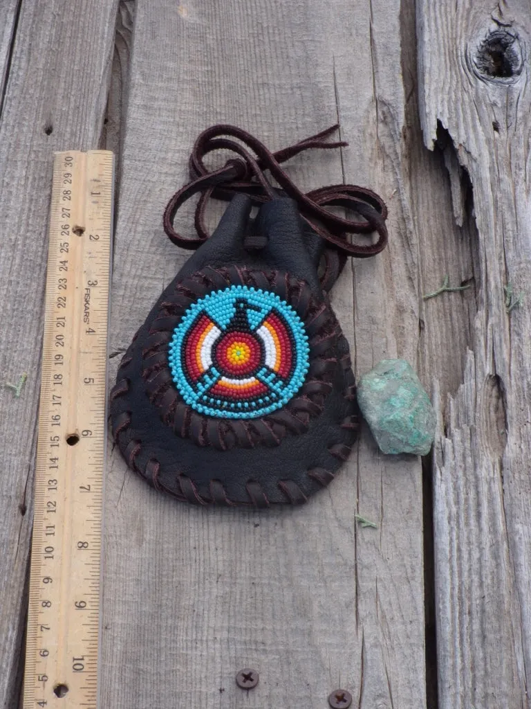 Amulet bag with beaded Thunderbird, necklace bag , leather medicine pouch