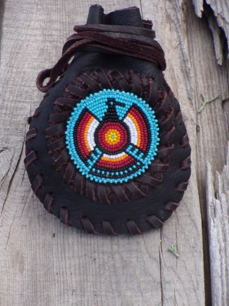 Amulet bag with beaded Thunderbird, necklace bag , leather medicine pouch