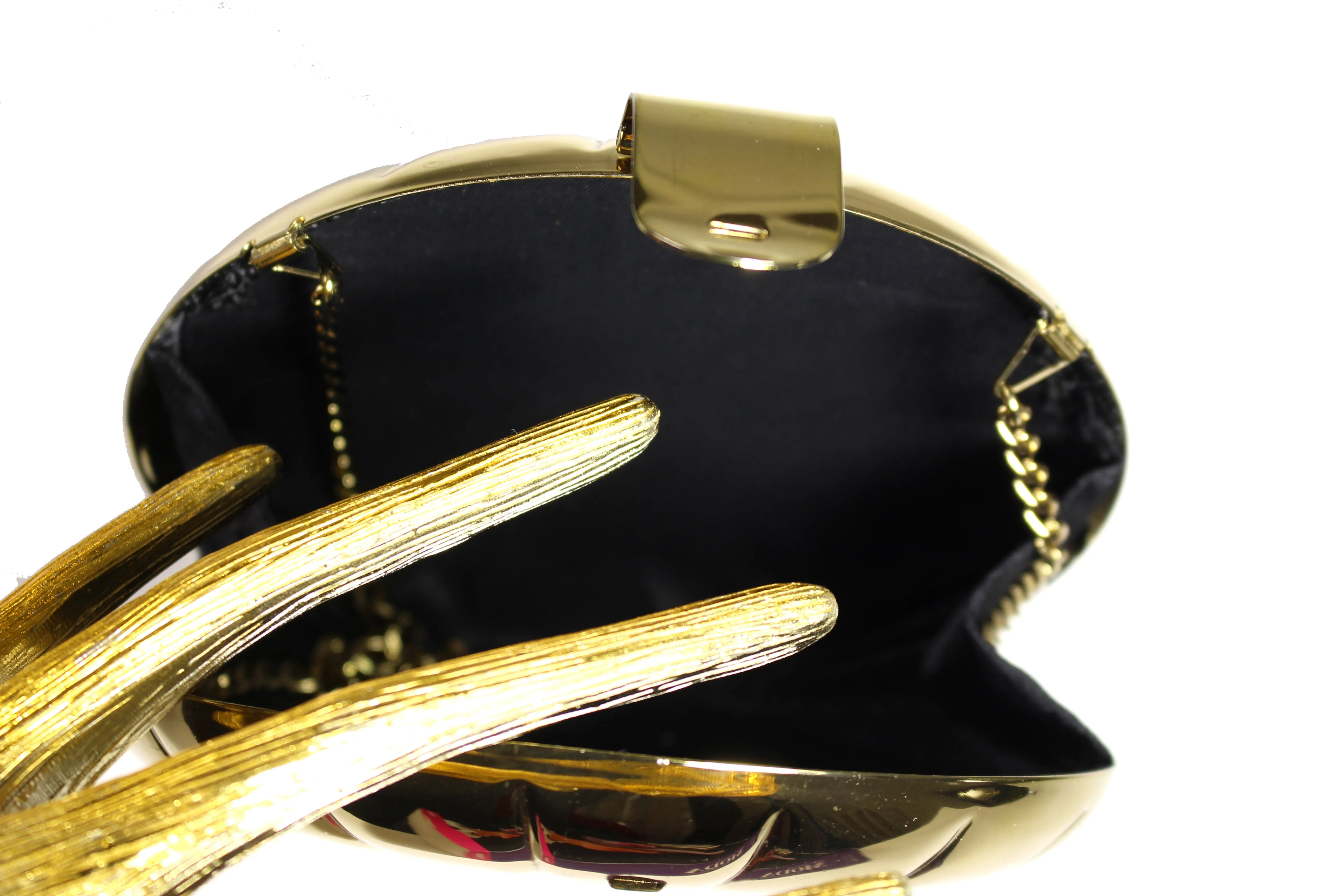 Metallic gold circular clutch with radial embossing